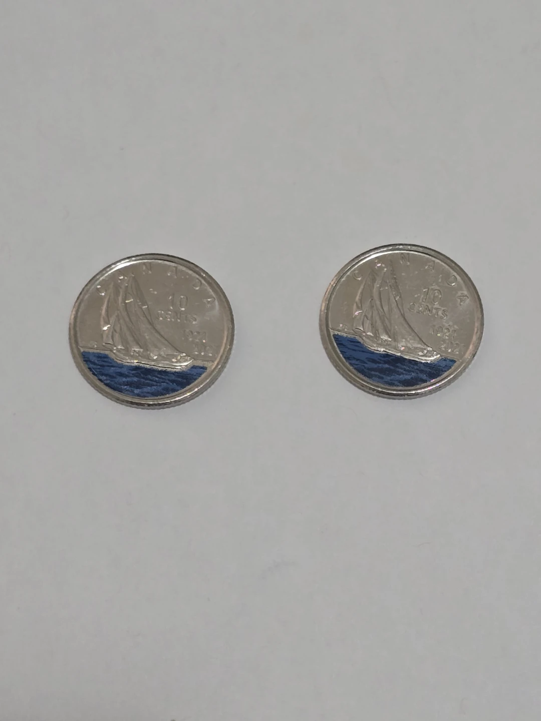 Two Canadian 10 Cent Coins