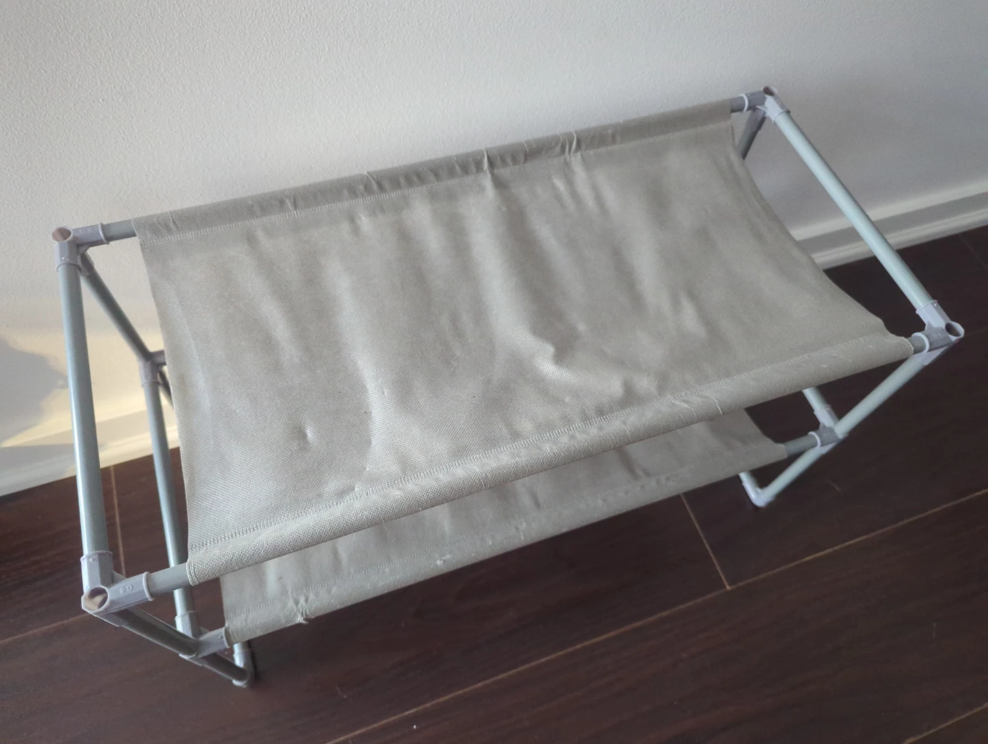 Grey fabric shoe rack