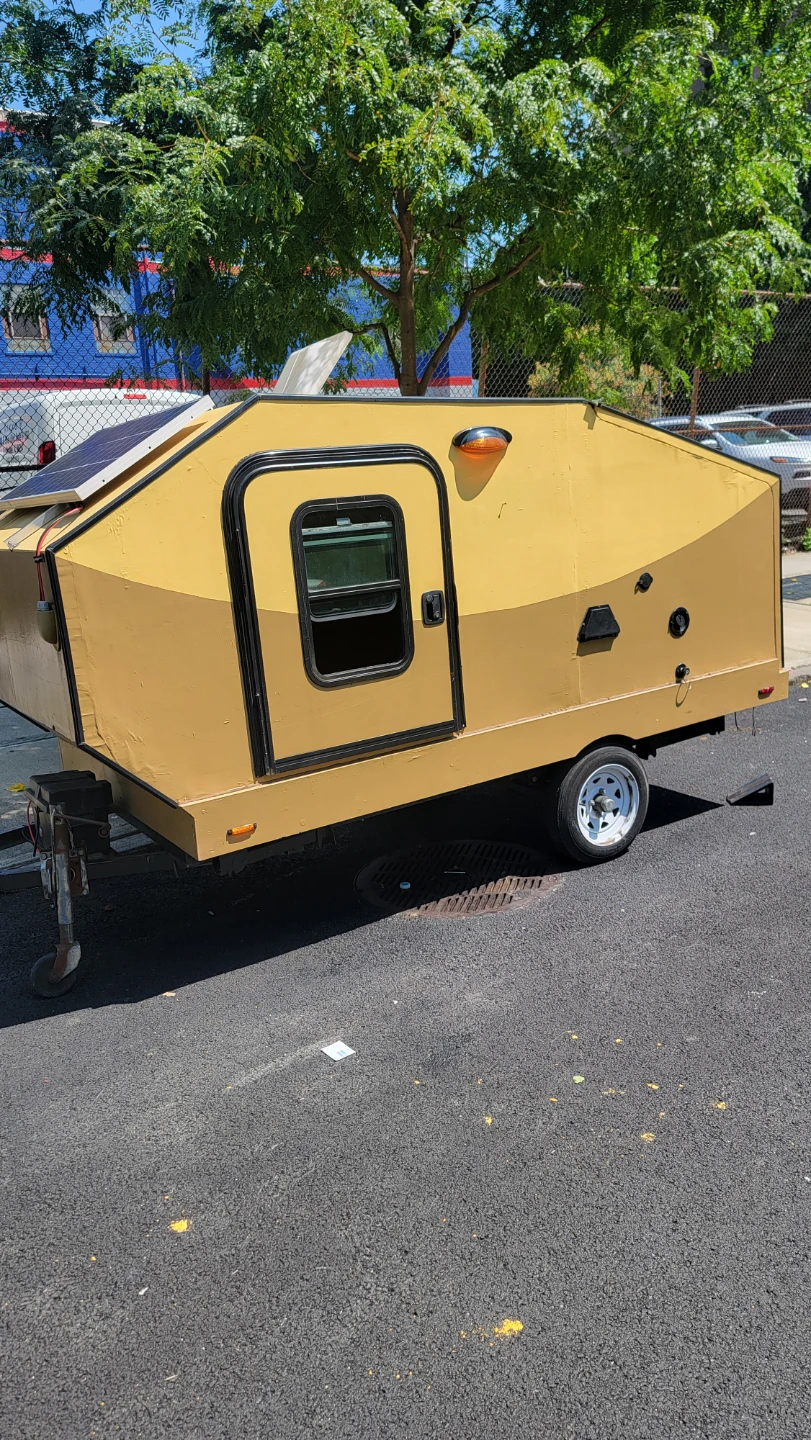 Yellow Teardrop Camper Trailer with Solar Panels