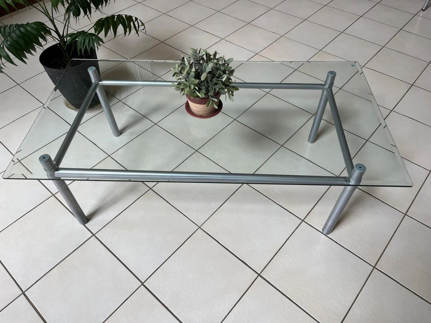 Glass top coffee table with metal frame