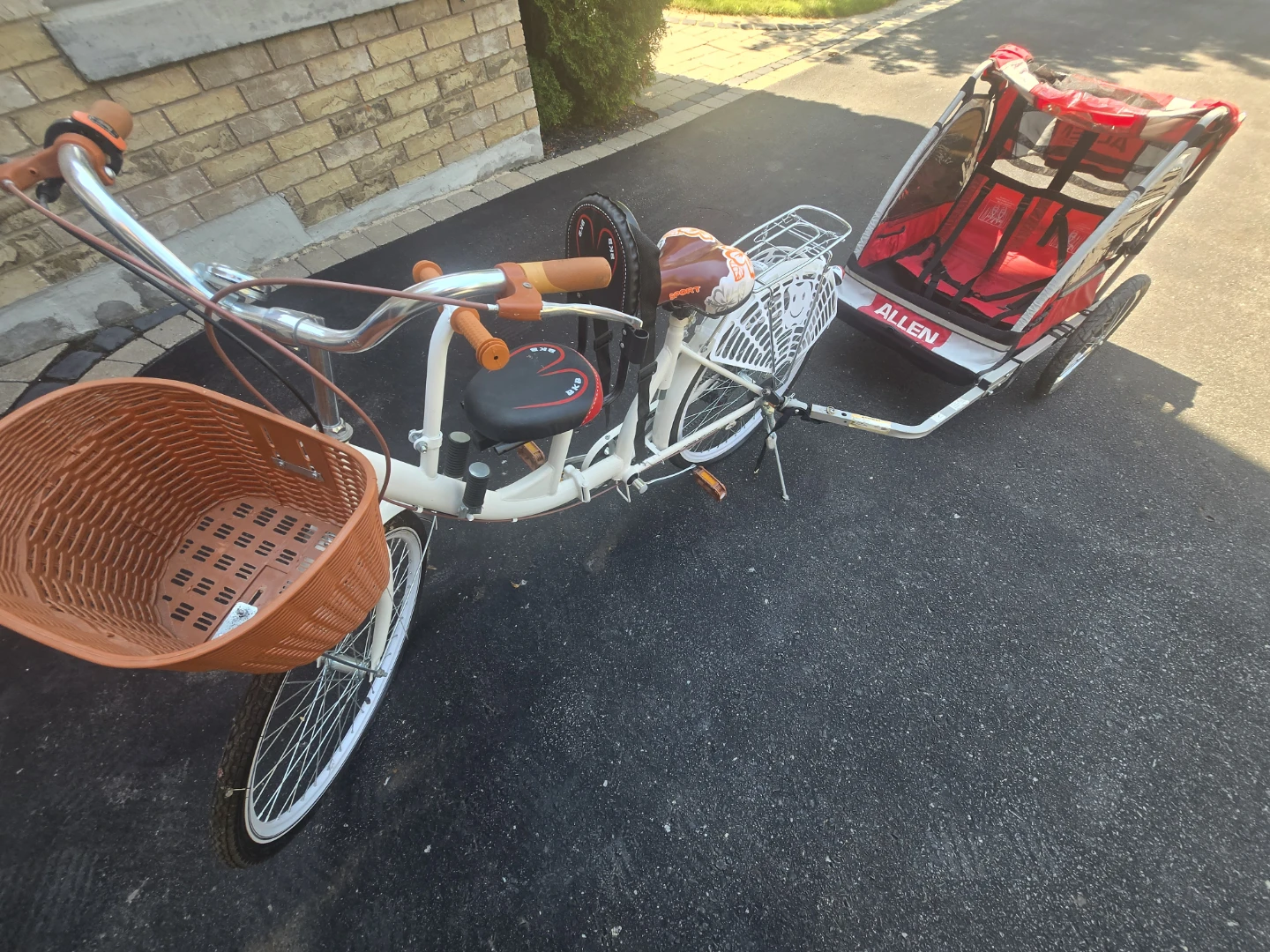 White Retro folding bicycle with Allen Child Trailer