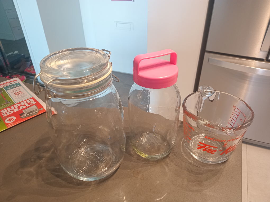 2 Glass Jars and 1 Measuring Cup Set