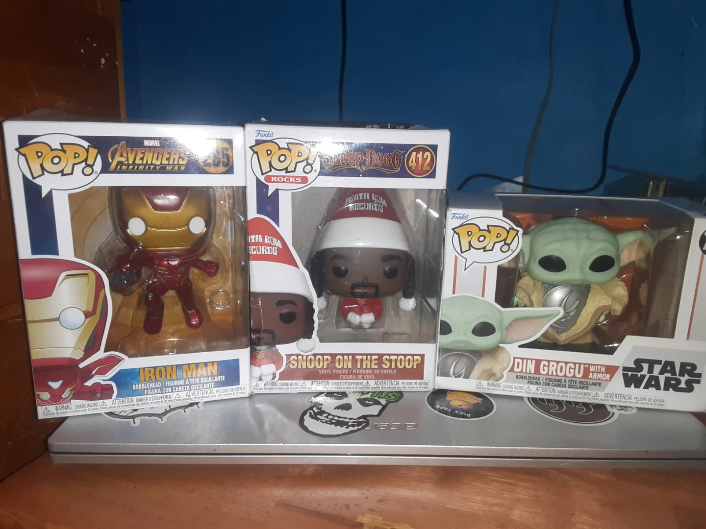 Funko Pop! Marvel Iron Man, Snoop Dogg, and Din Grogu figures