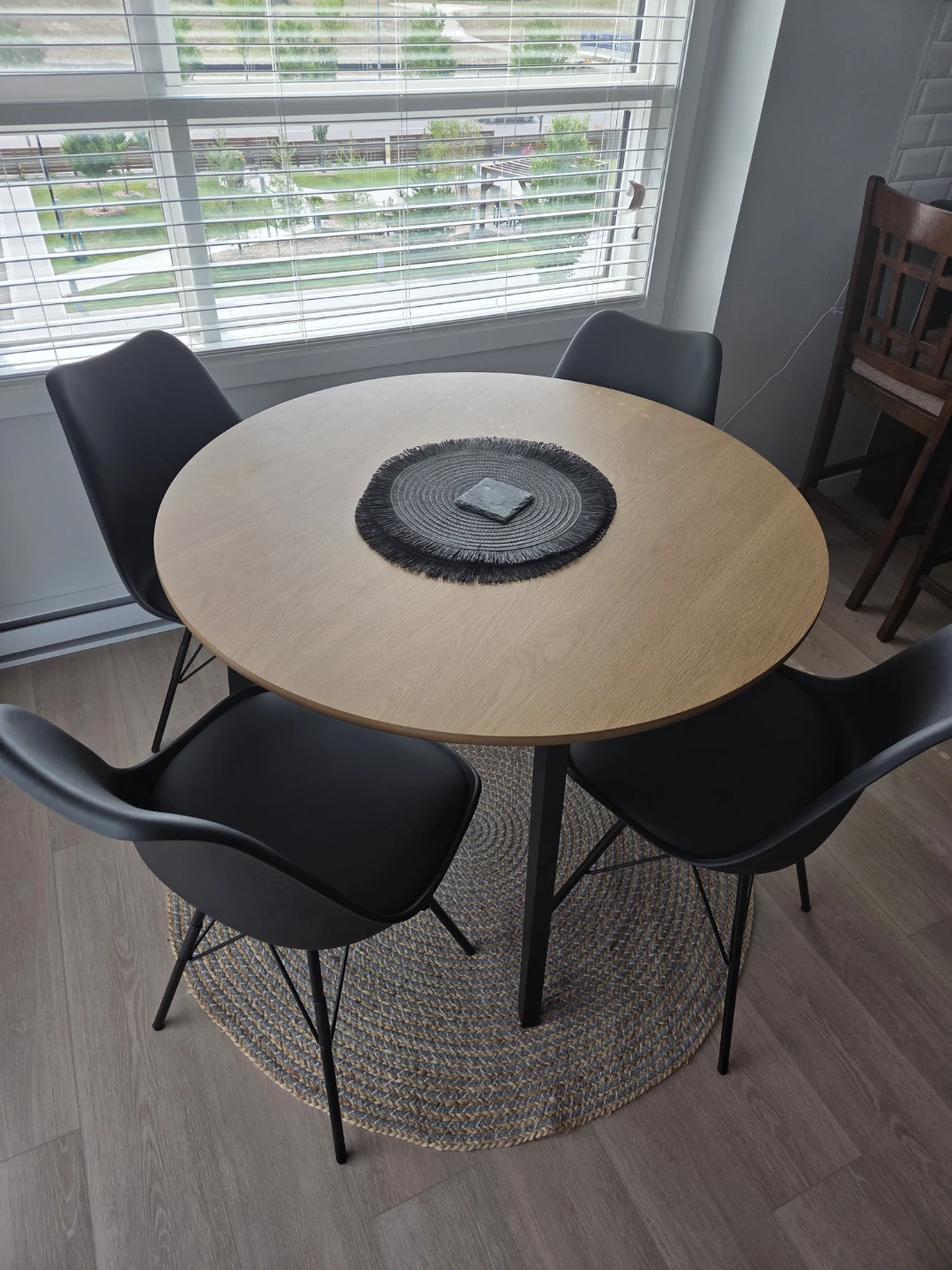 Round Wood Dining Table with 4 Black Chairs