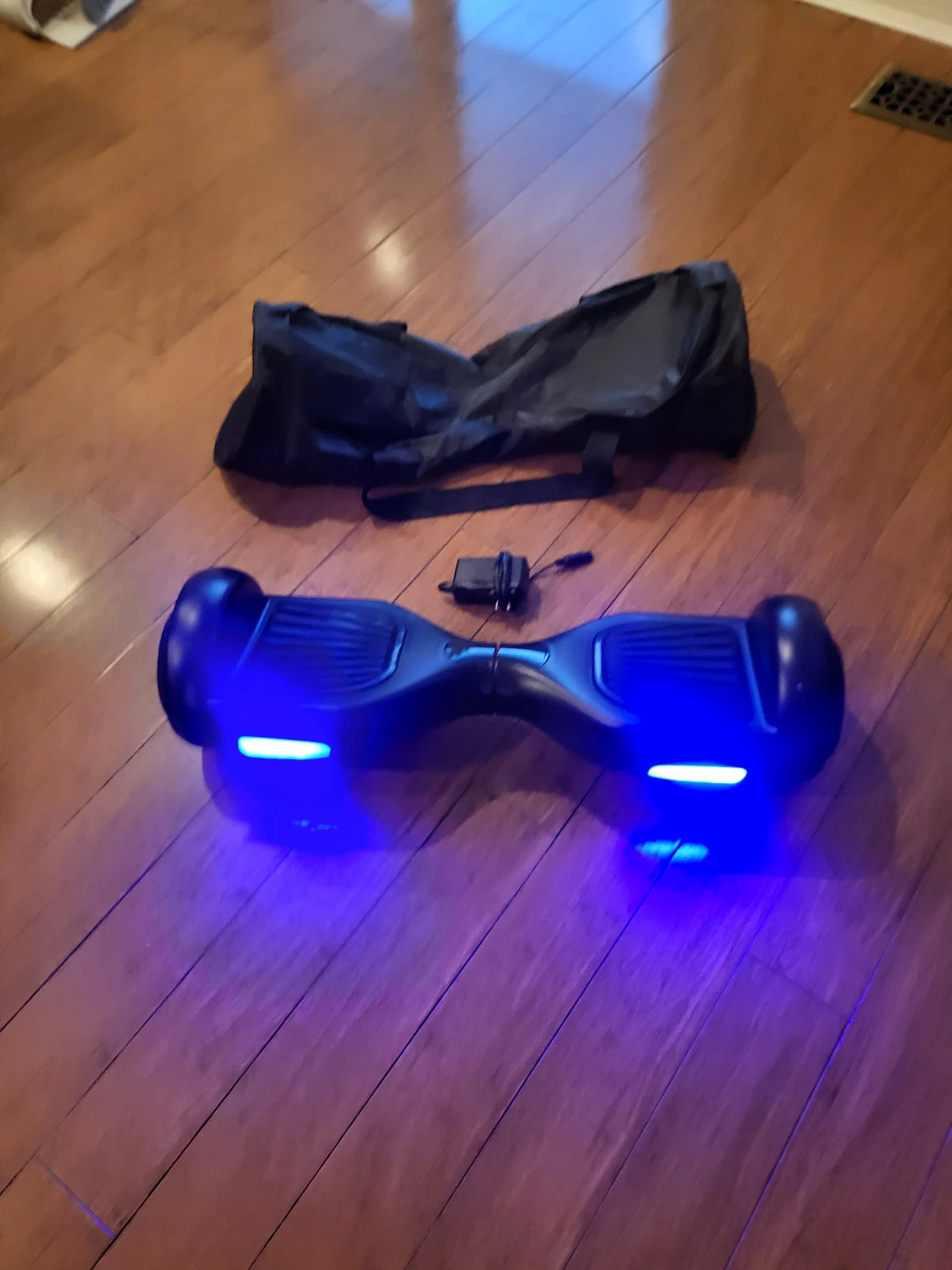 Black Wheelmotion Hoverboard with Carrying Bag and Charger