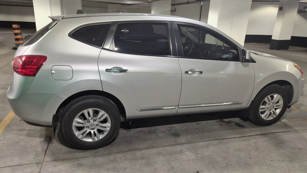 Silver Nissan Rogue SUV - photo 2