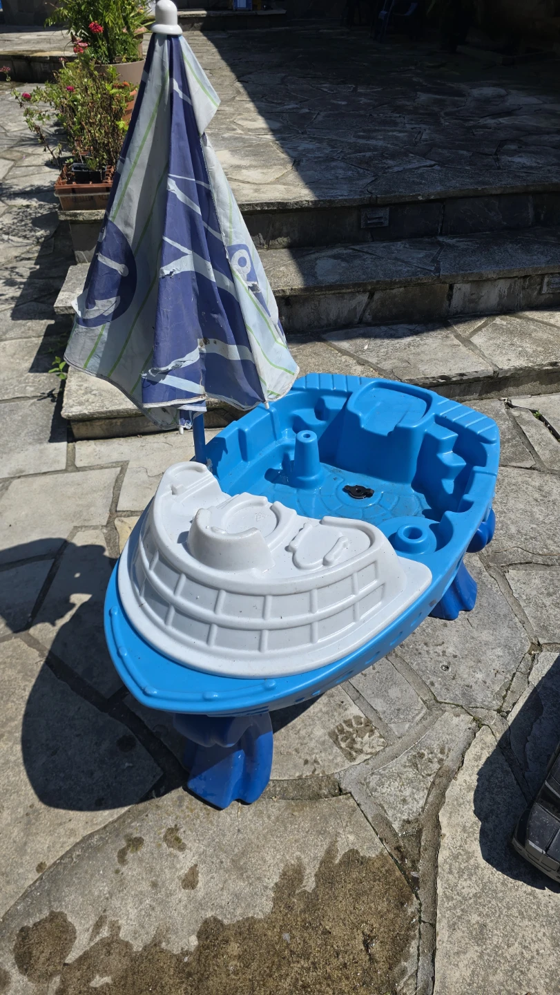 Blue and White Boat Water Table with Umbrella