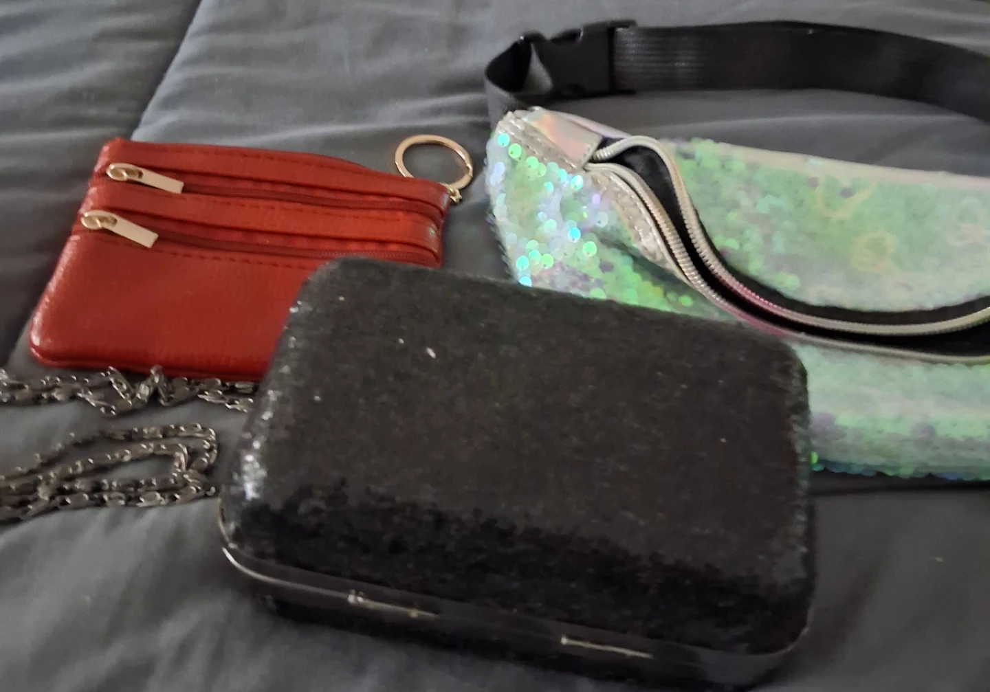 Black sequined clutch with chain strap