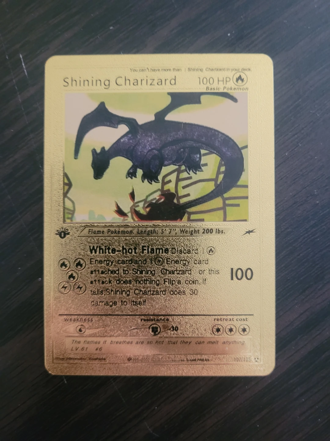 Rare gold foil shining charizard 107/105