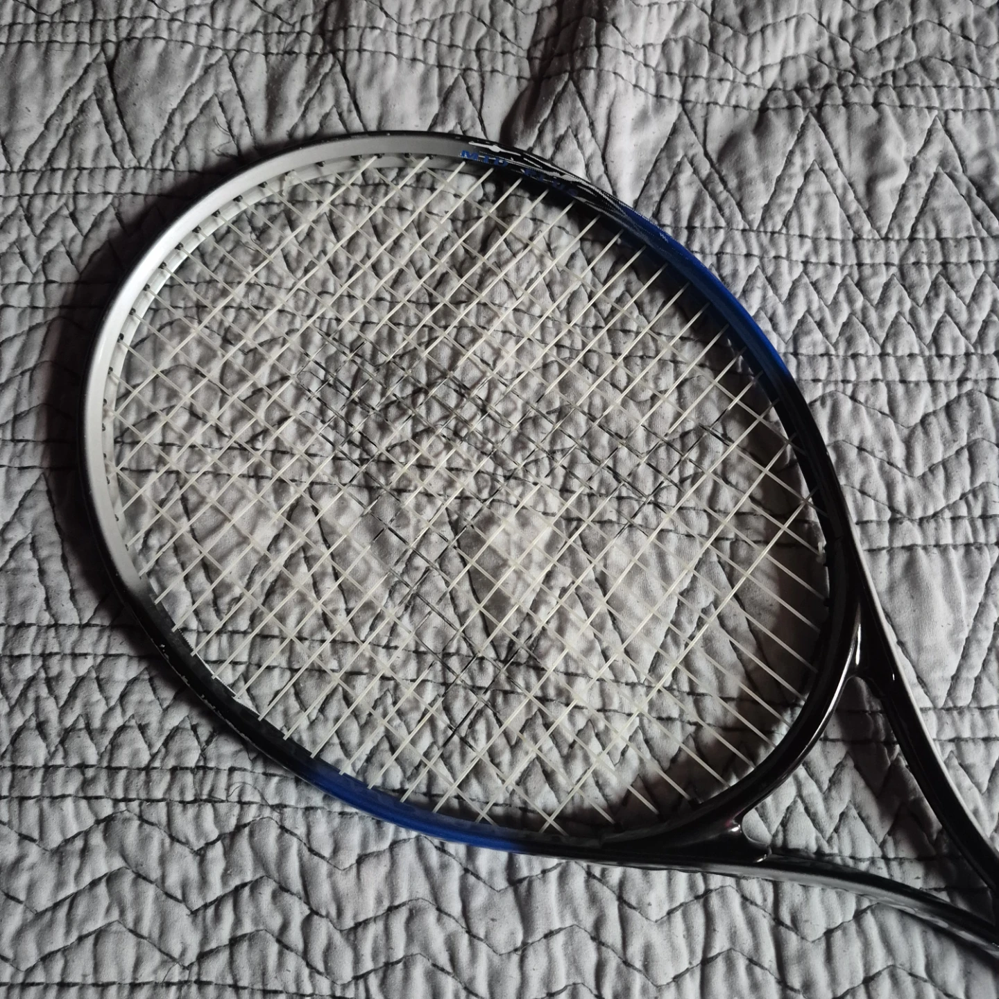 Black and blue tennis racket