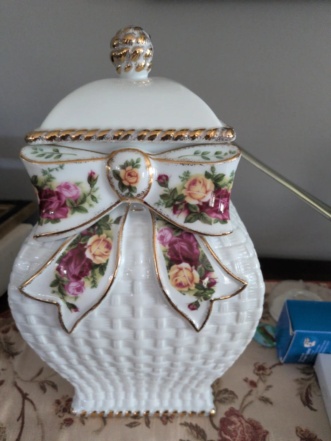 Decorative ceramic jar with floral bow