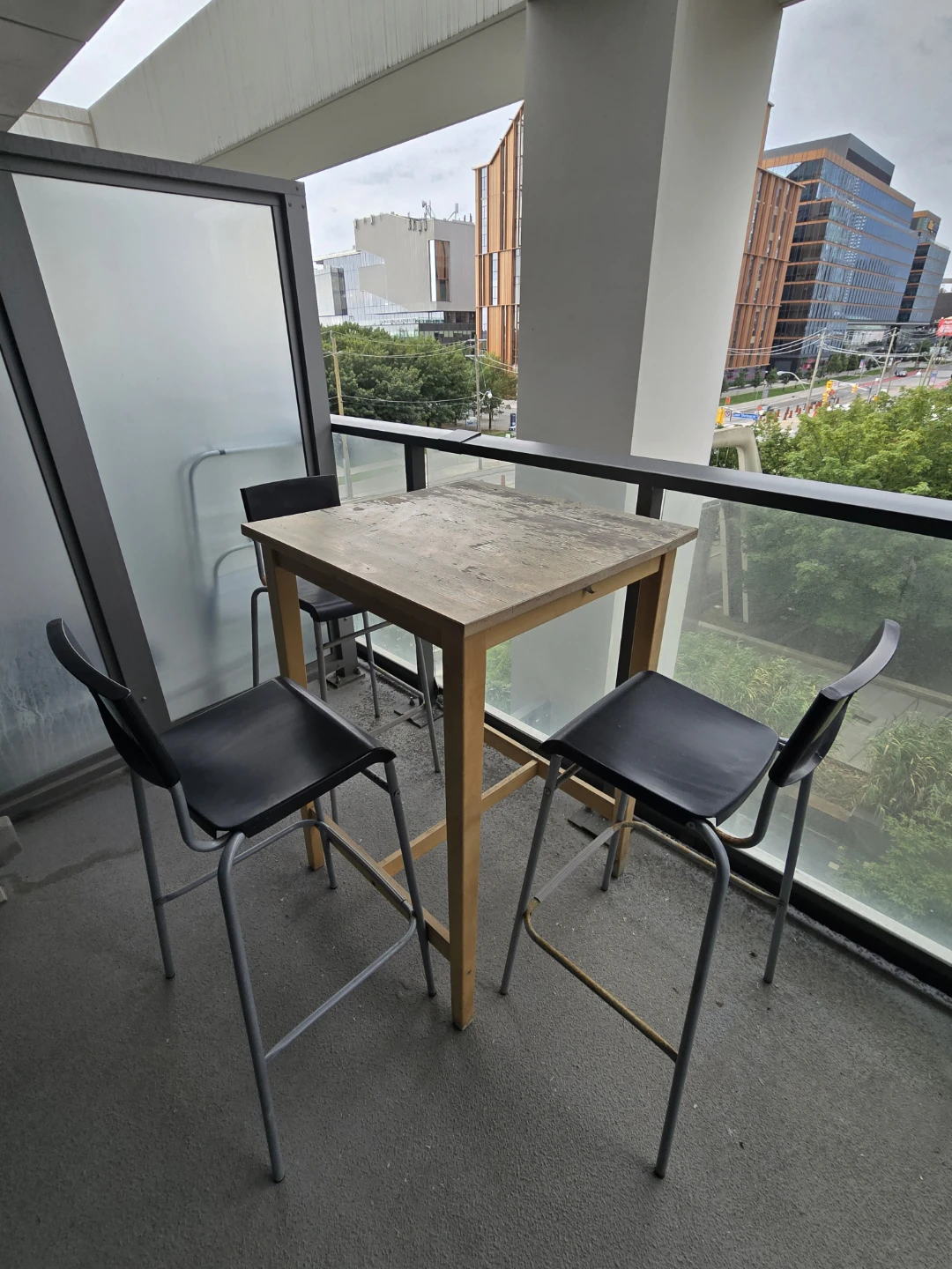 IKEA wooden bar table with three chairs