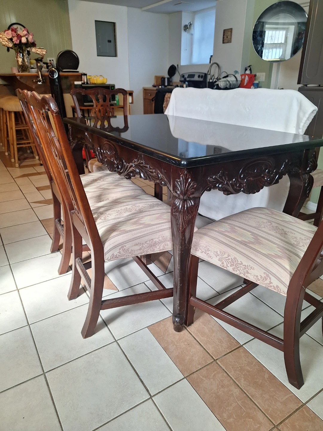 Carved vintage-style table with a black marble top