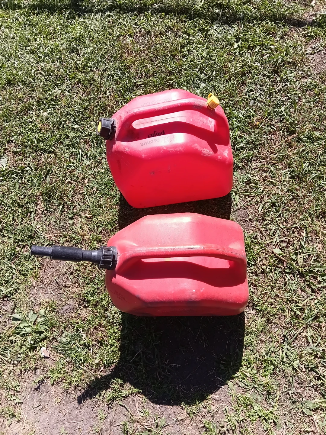 Two red plastic gas cans