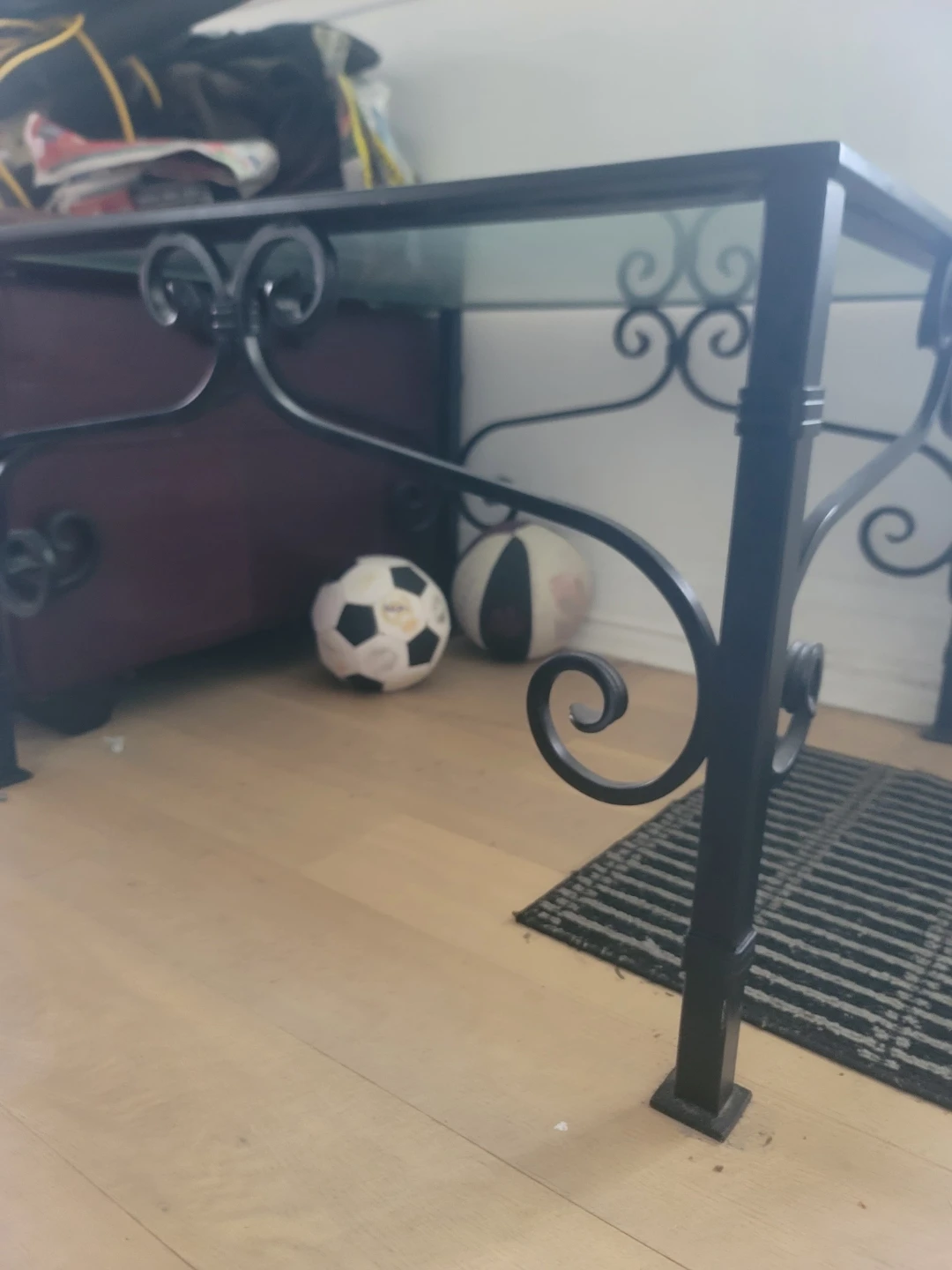 Glass top end table with metal scrollwork - photo 2