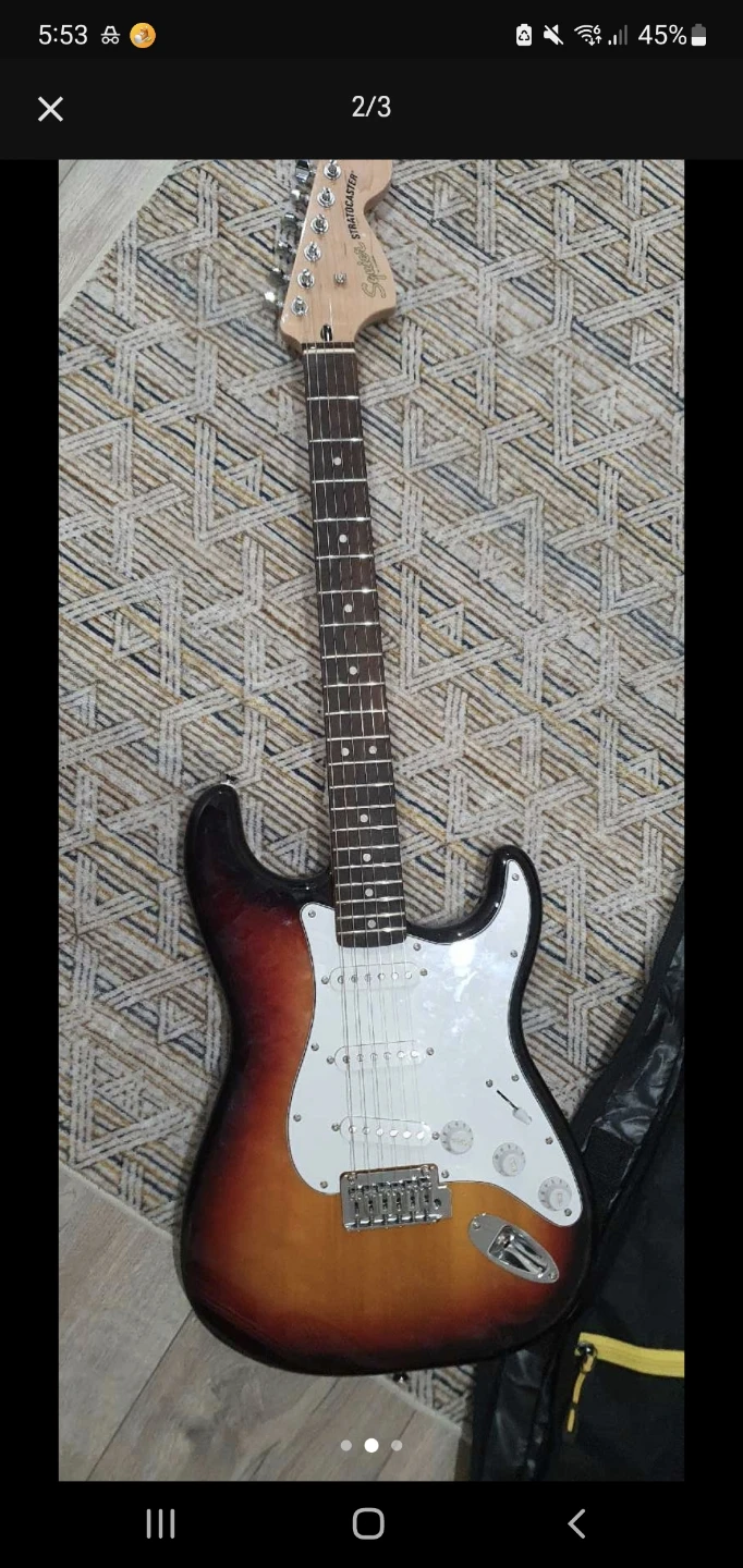 Squier Stratocaster Electric Guitar Bundle with Tuner and Case