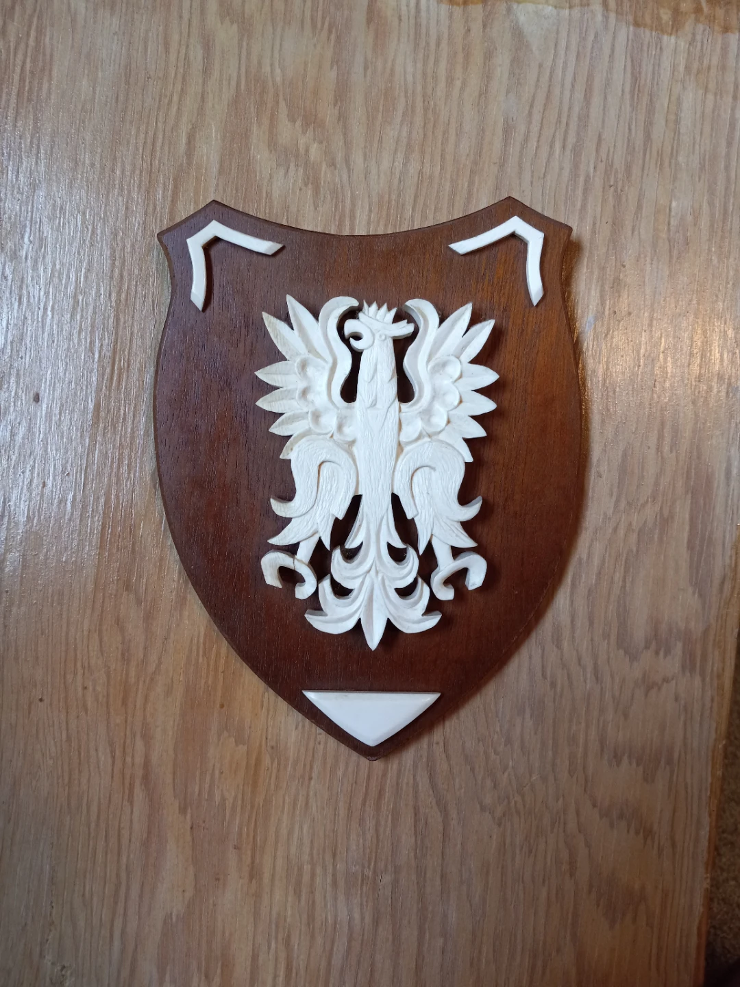 7 inch ivory on wood wall hanging