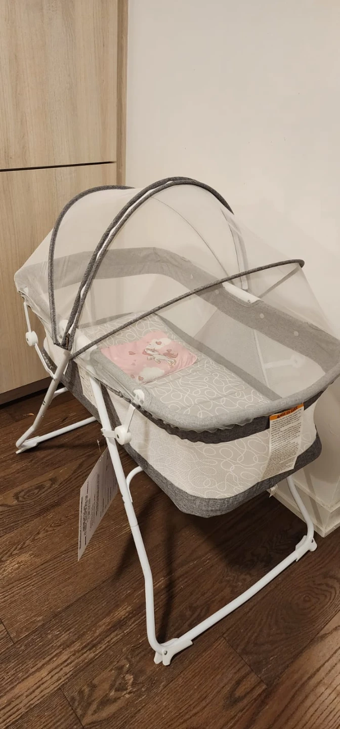 Light used Bassinet for sale with mesh protective  cover