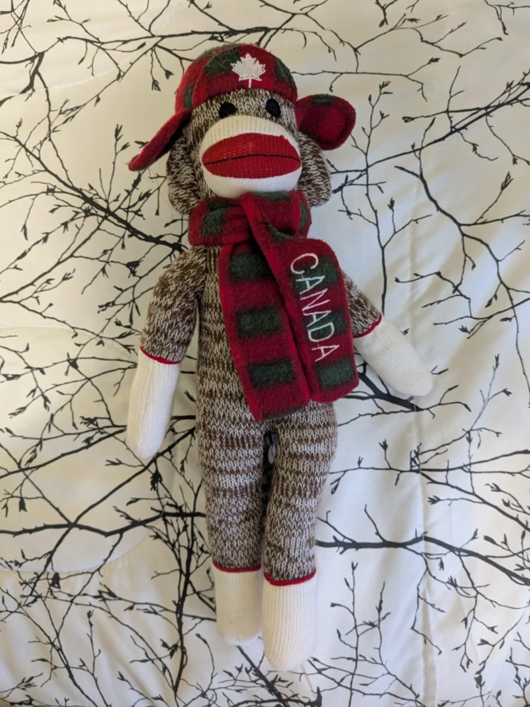 Sock monkey with Canadian hot and scarf