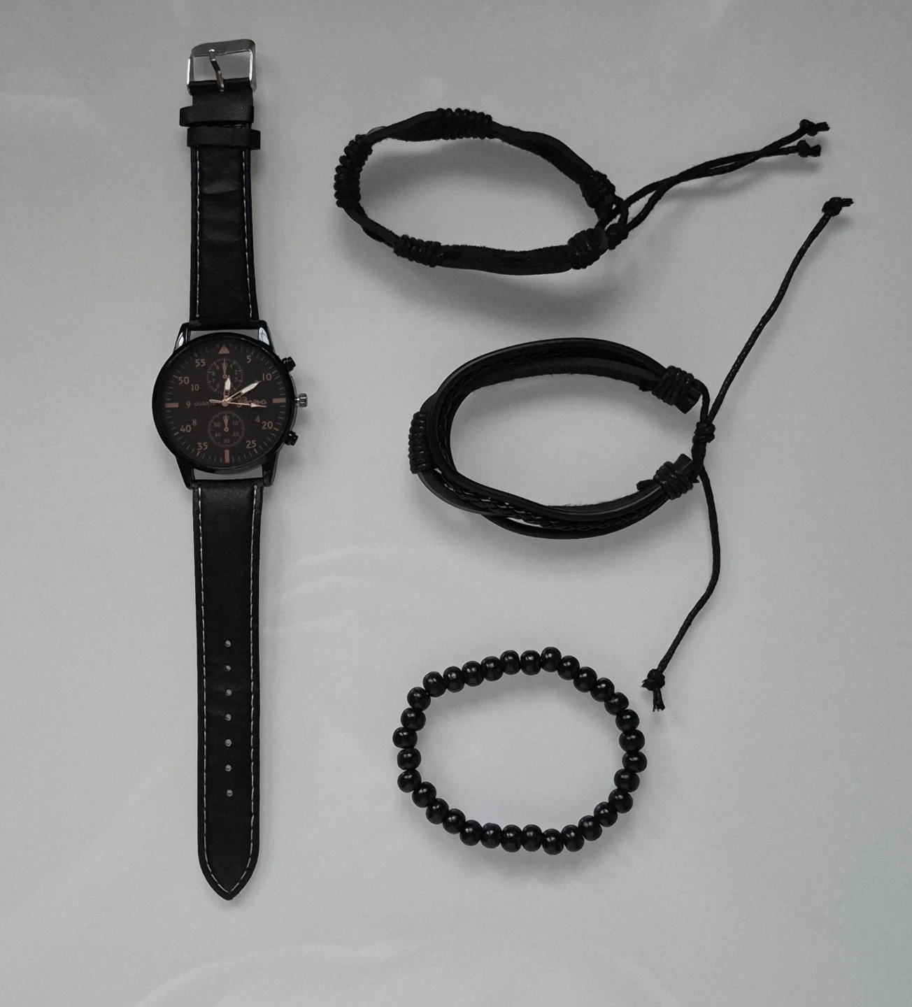 Classic Black Men’s Watch + 3 Bracelets — $10