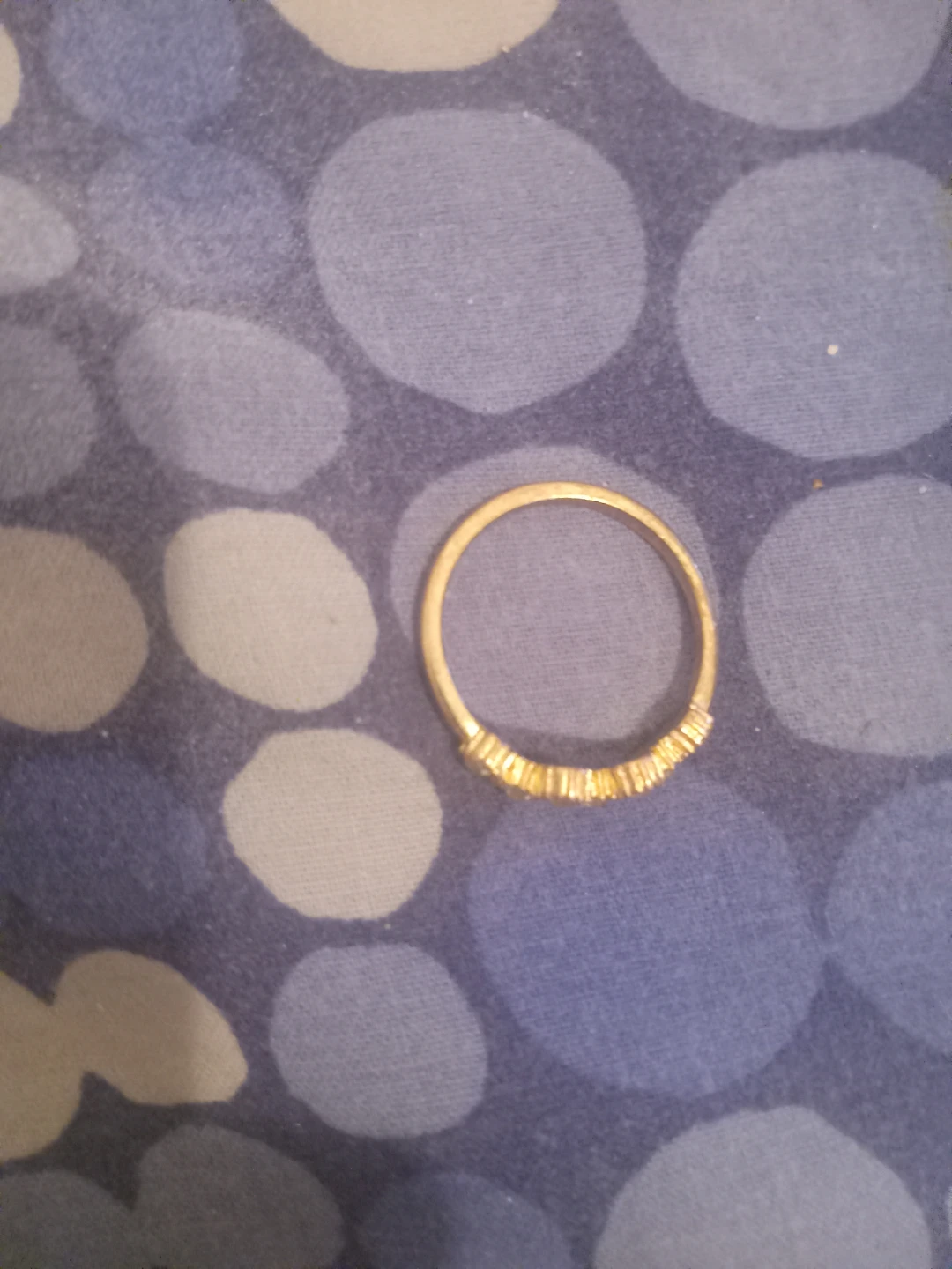 Gold-tone band ring with clear stones