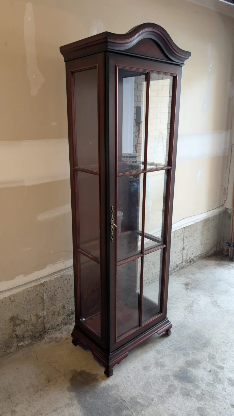 Wooden curio cabinet with glass shelves