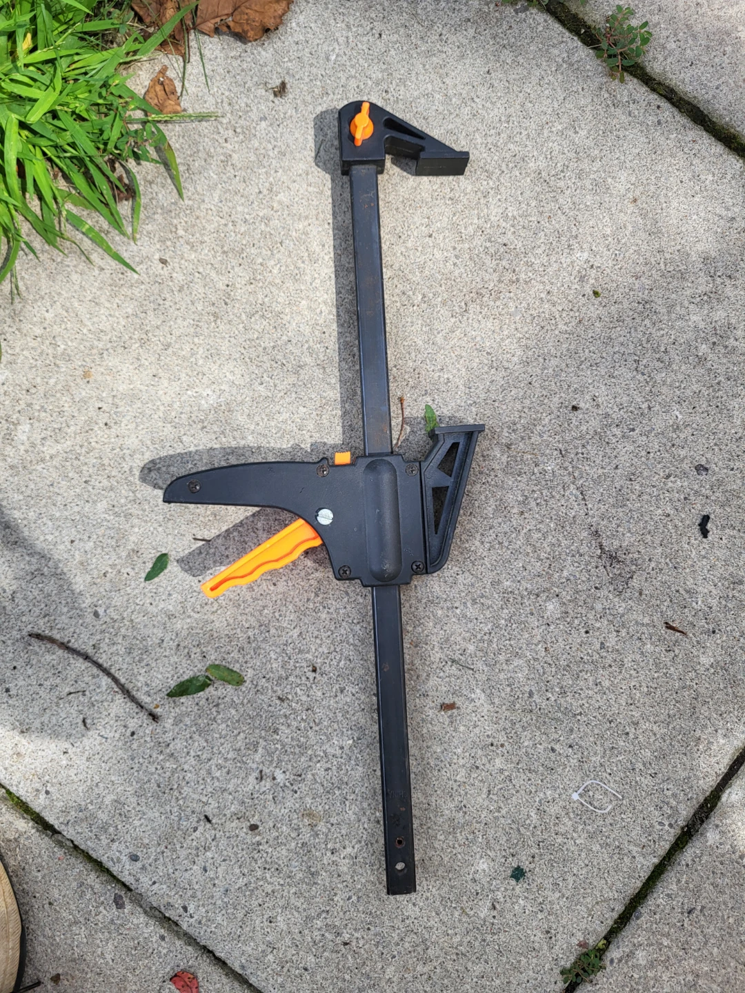 Black and orange trigger bar clamp
