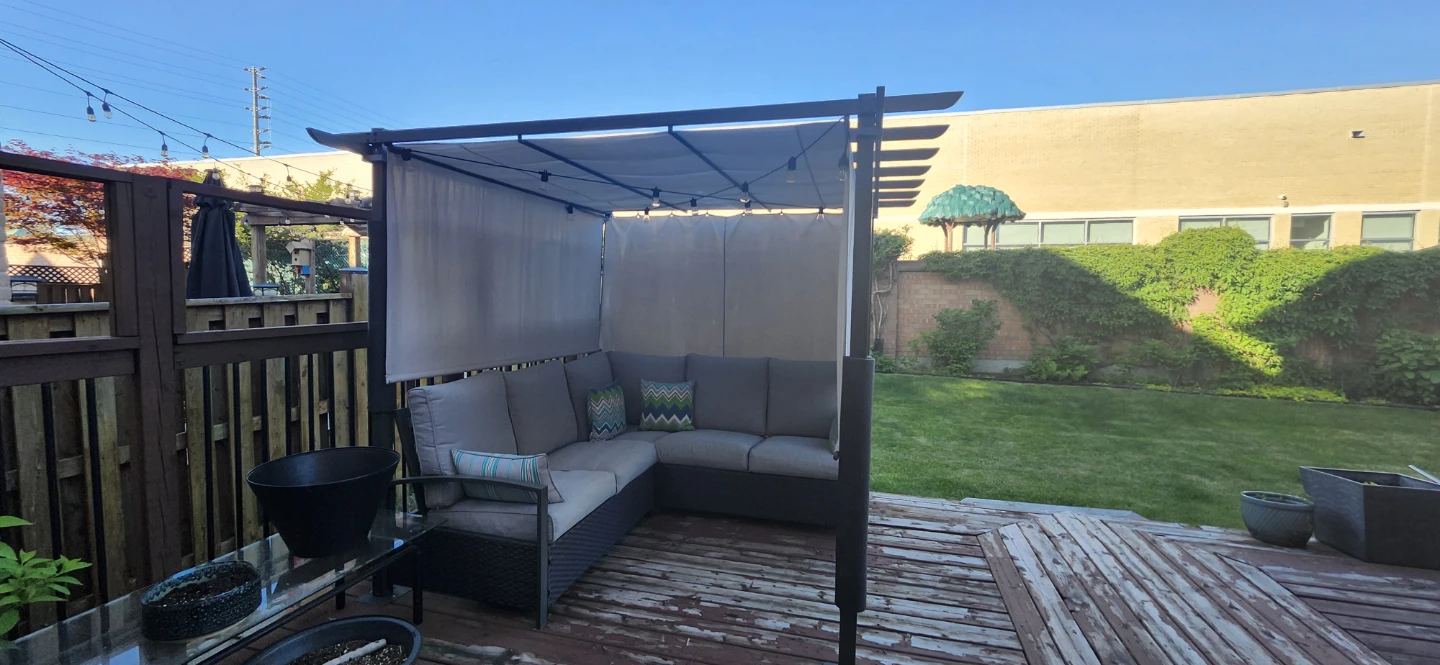 Outdoor Pergola with Sectional Sofa and String Lights