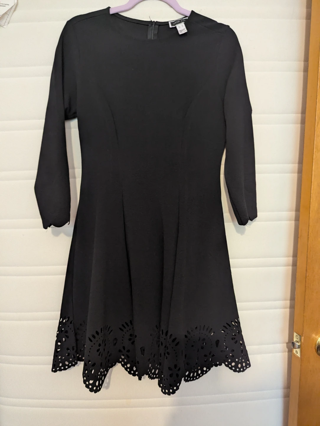 Black dress with eyelet hem