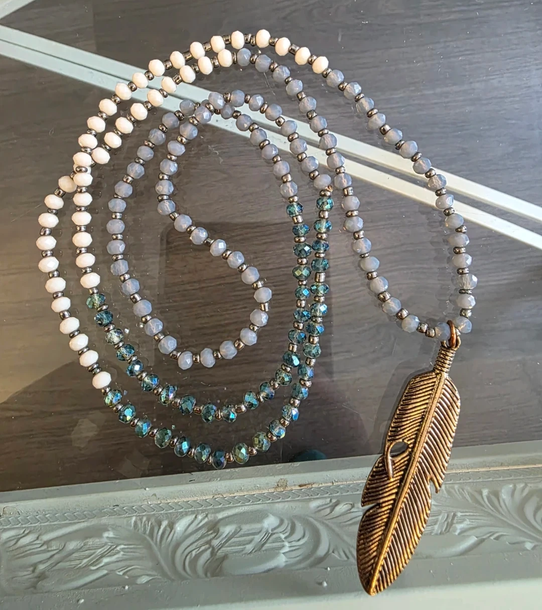 Beaded Necklace with Feather Pendant