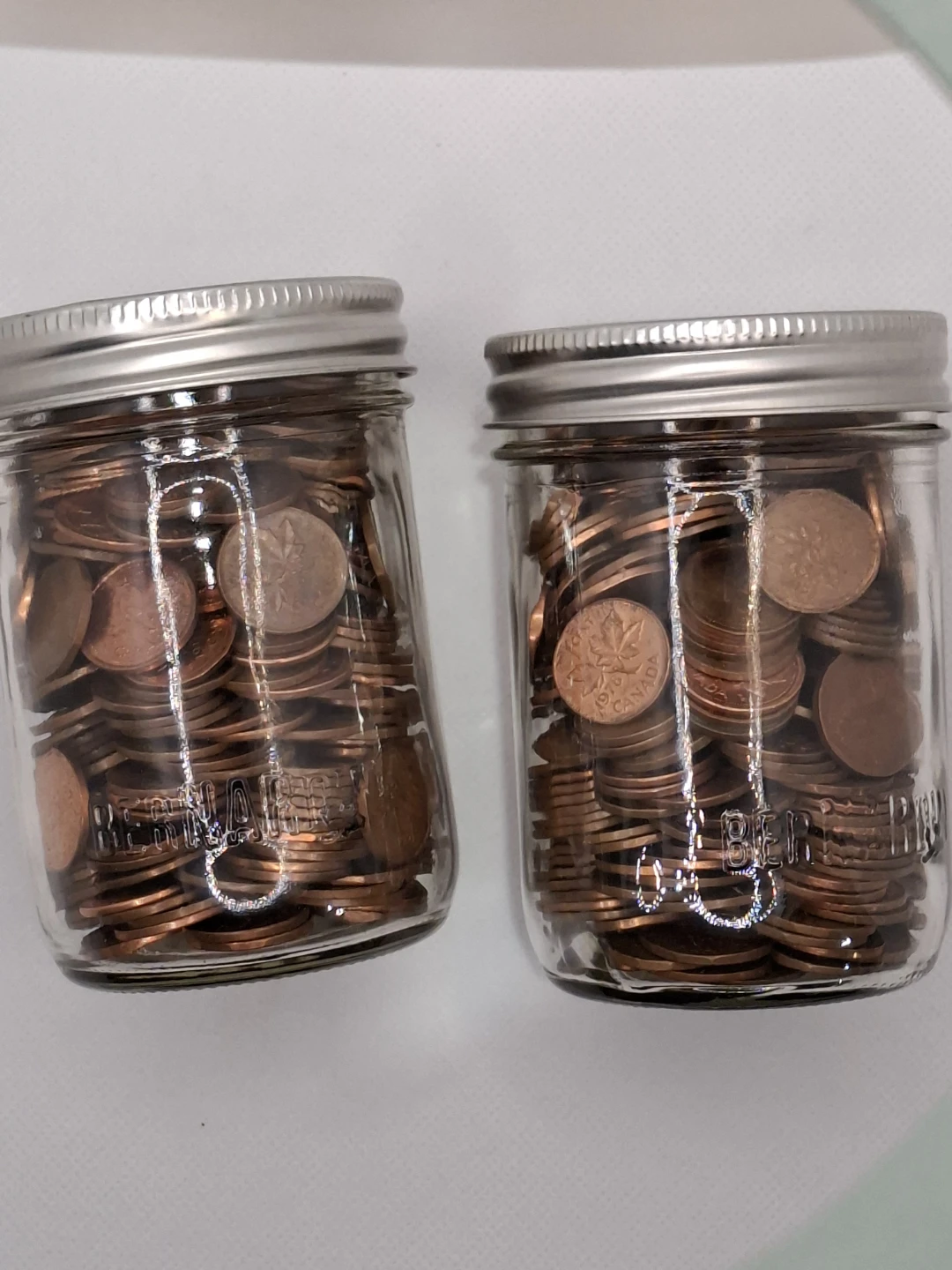 Two Jars Full of Canadian Pennies