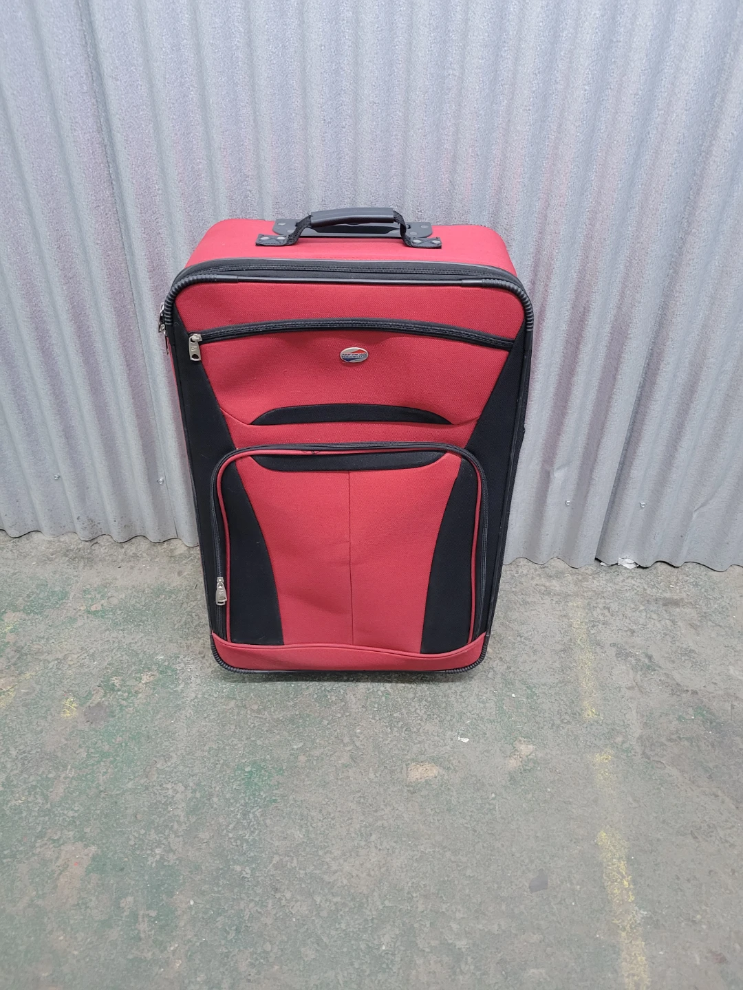 Like new Red and Black Rolling Suitcase