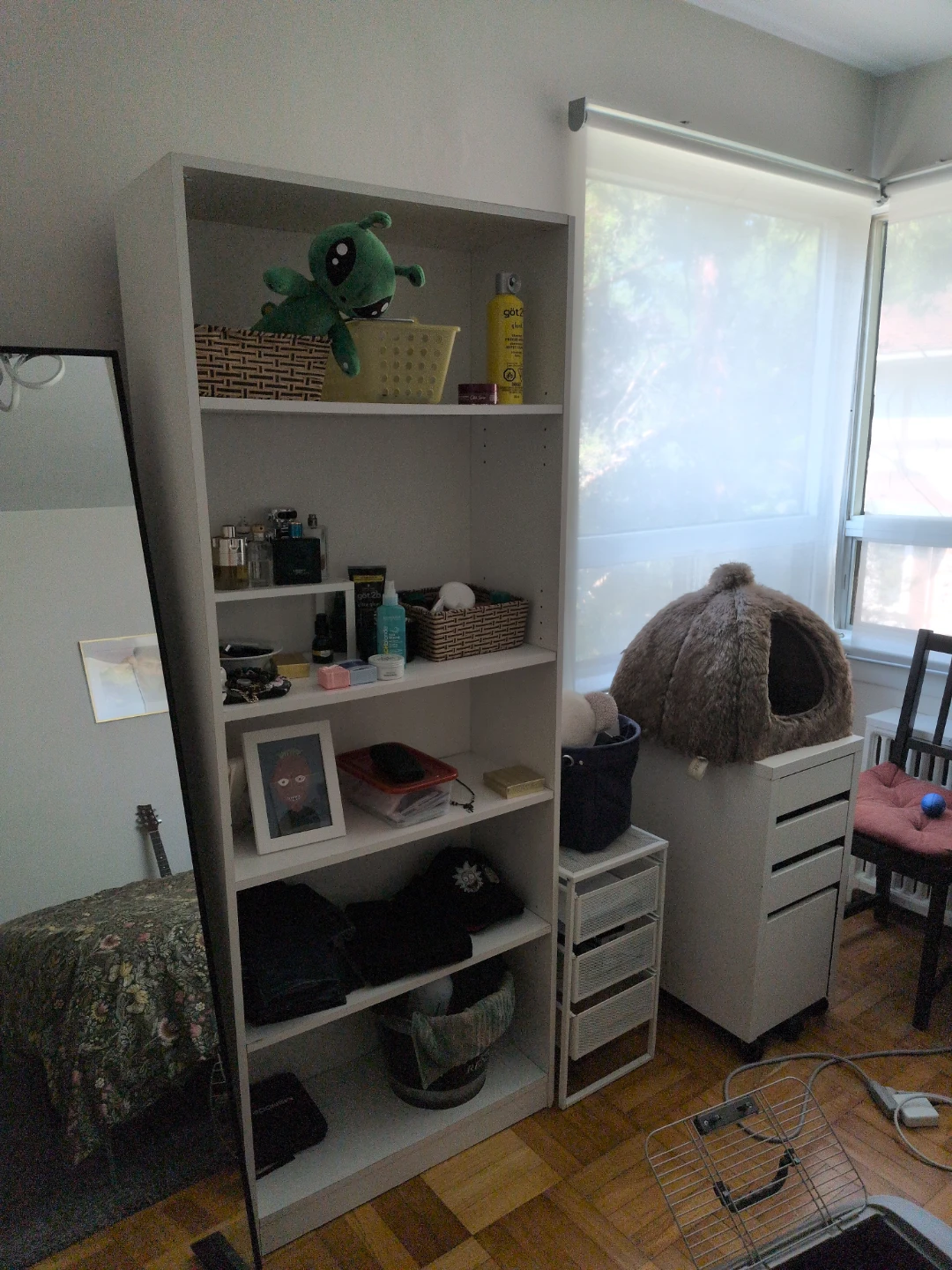 Tall white shelving unit