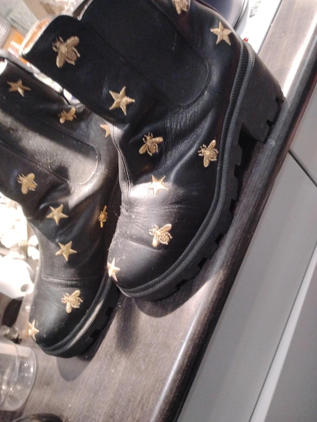 GUCCI. Black Leather Boots with Star and Bee Embellishments