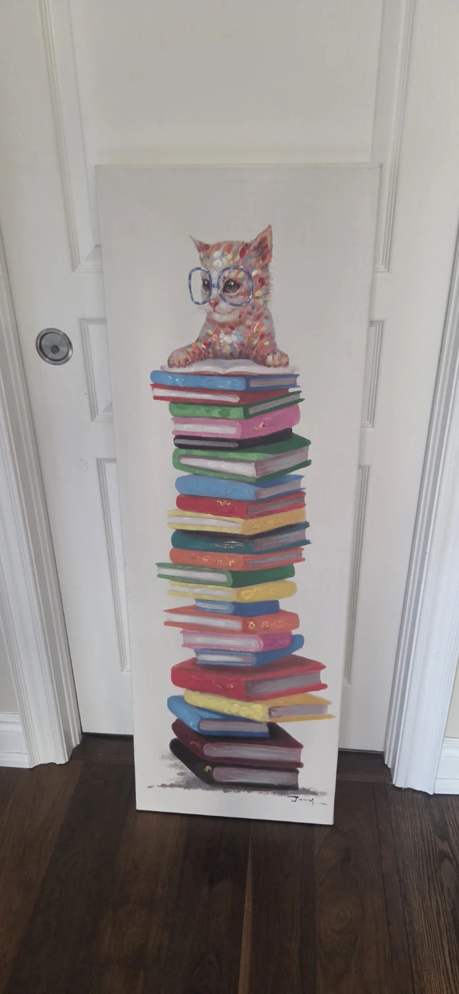 Painting of a cat on a stack of books