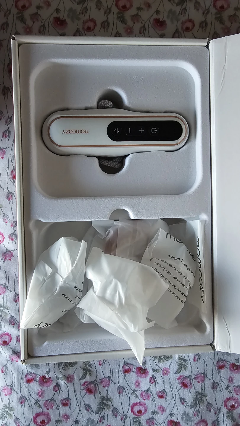 Momcozy breast pump with attachments