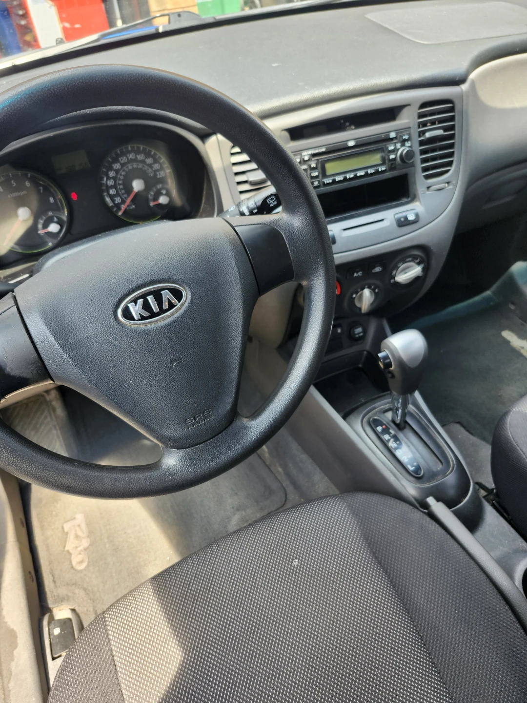 Blue Kia Rio Hatchback