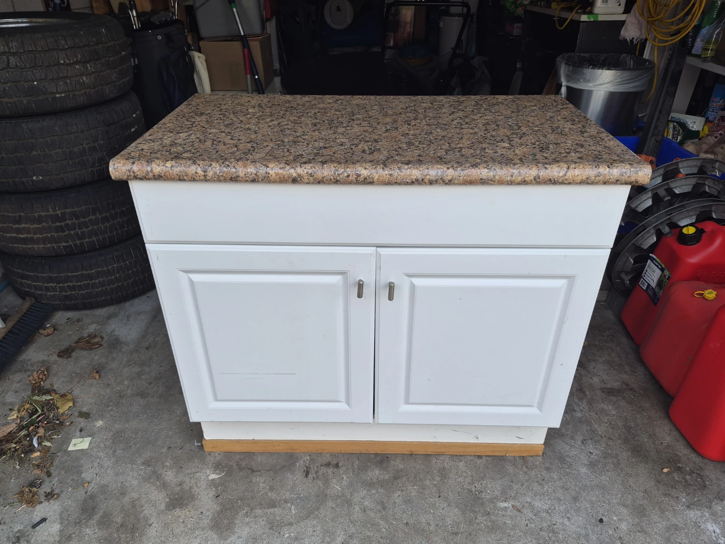 White cabinet with granite-look countertop
