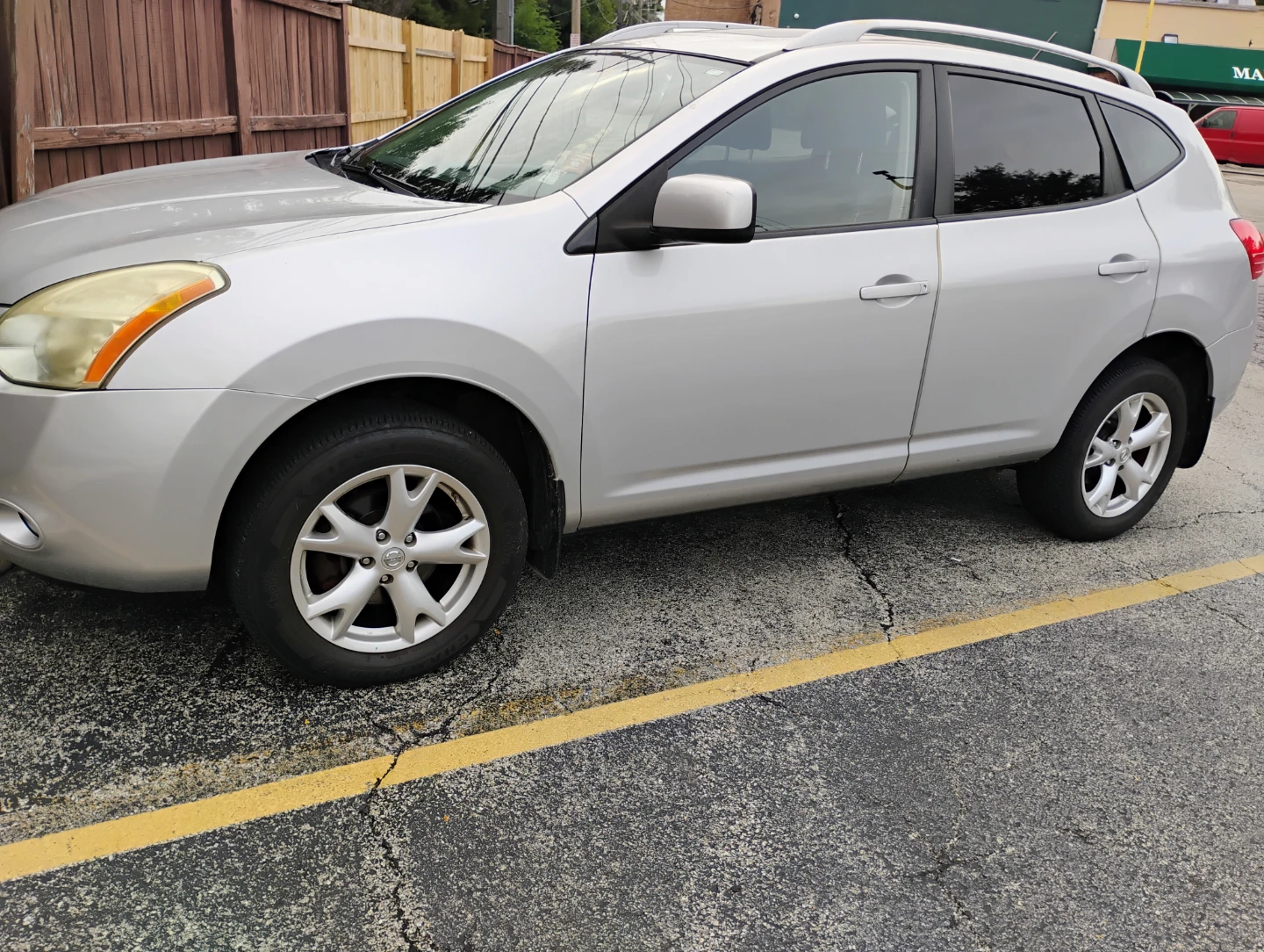 Silver Nissan Rogue SUV - photo 4