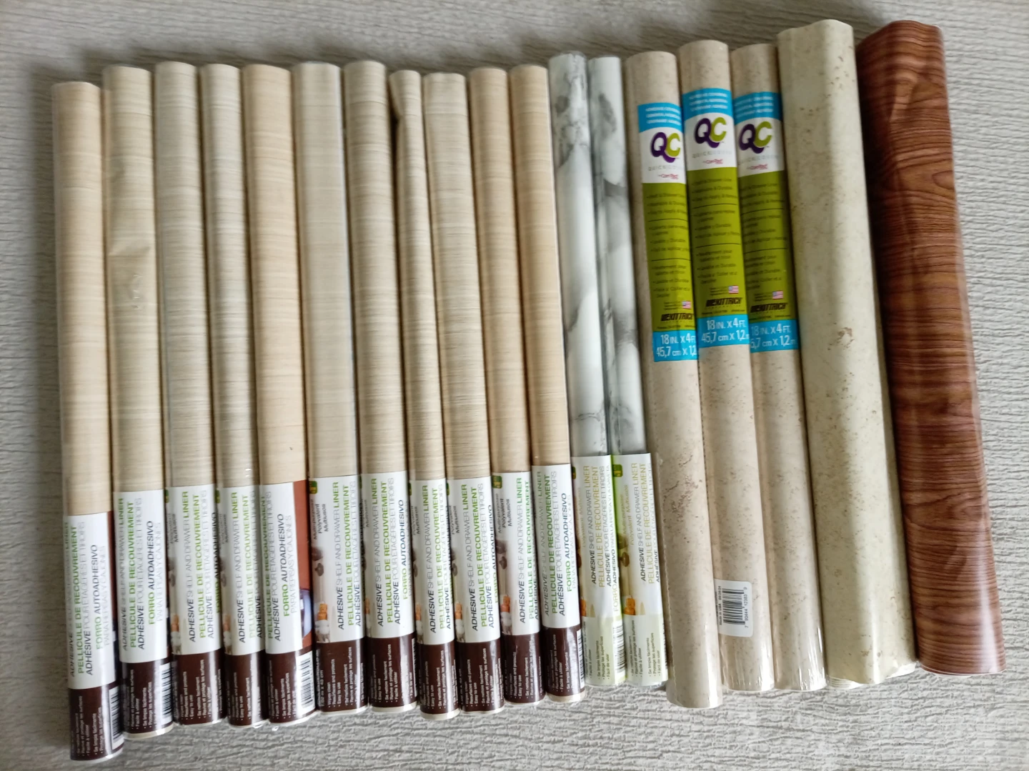 Bundles of assorted peel-and-stick vinyl shelf liner