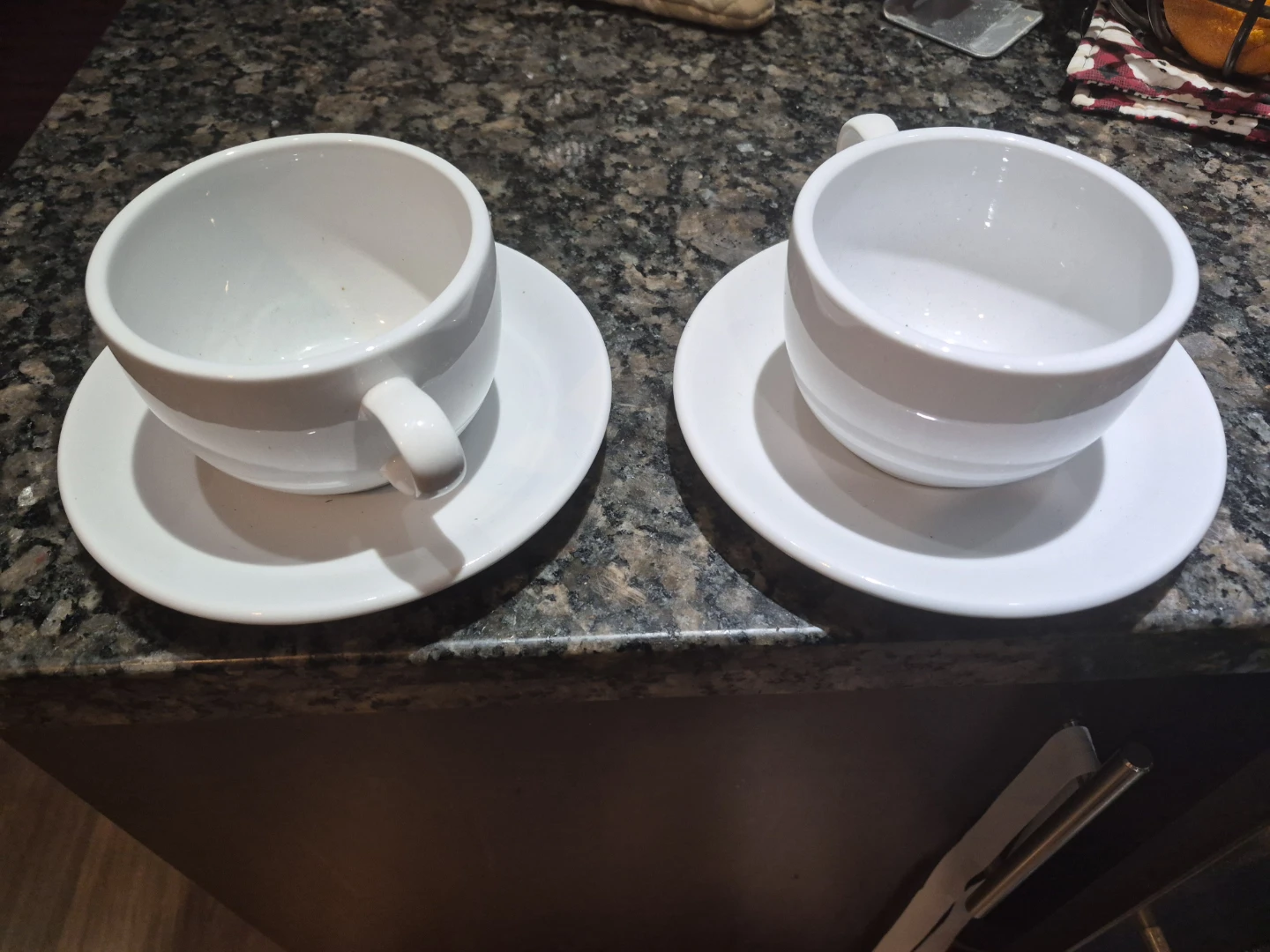 Pair of white cup and saucers