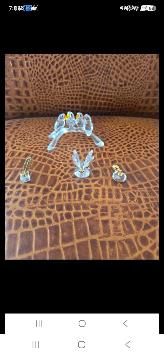 Swarovski,  Parrot,butterfly, perfume btl and feather pen.