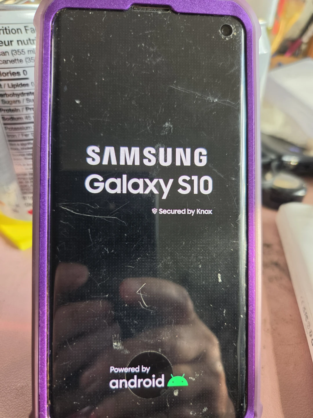 Samsung Galaxy S10 Phone with Purple Case