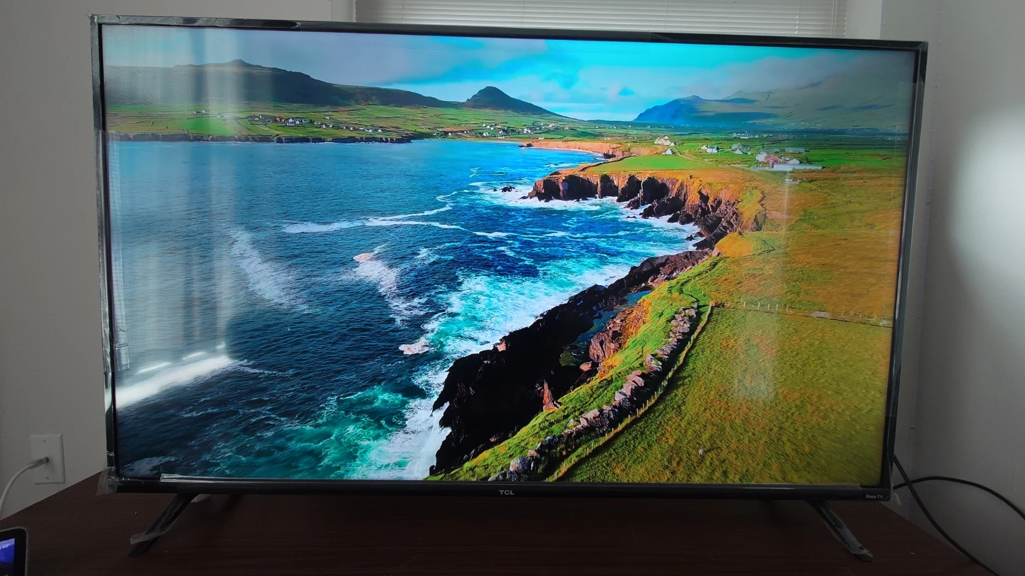 TCL Roku Smart TV & Wooden TV Stand - photo 2