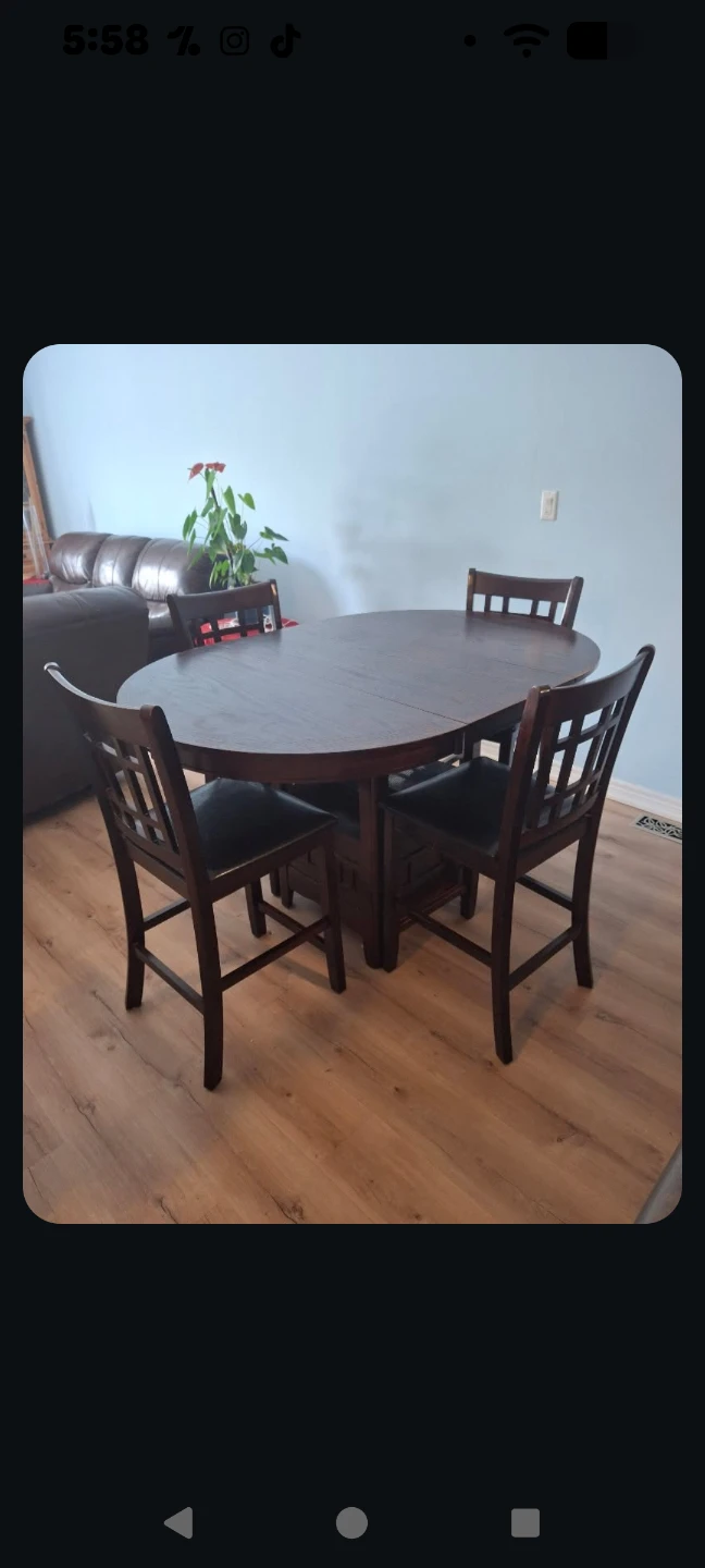 Dark Wood Oval Dining Table with 4 Chairs pick up is in Welland
