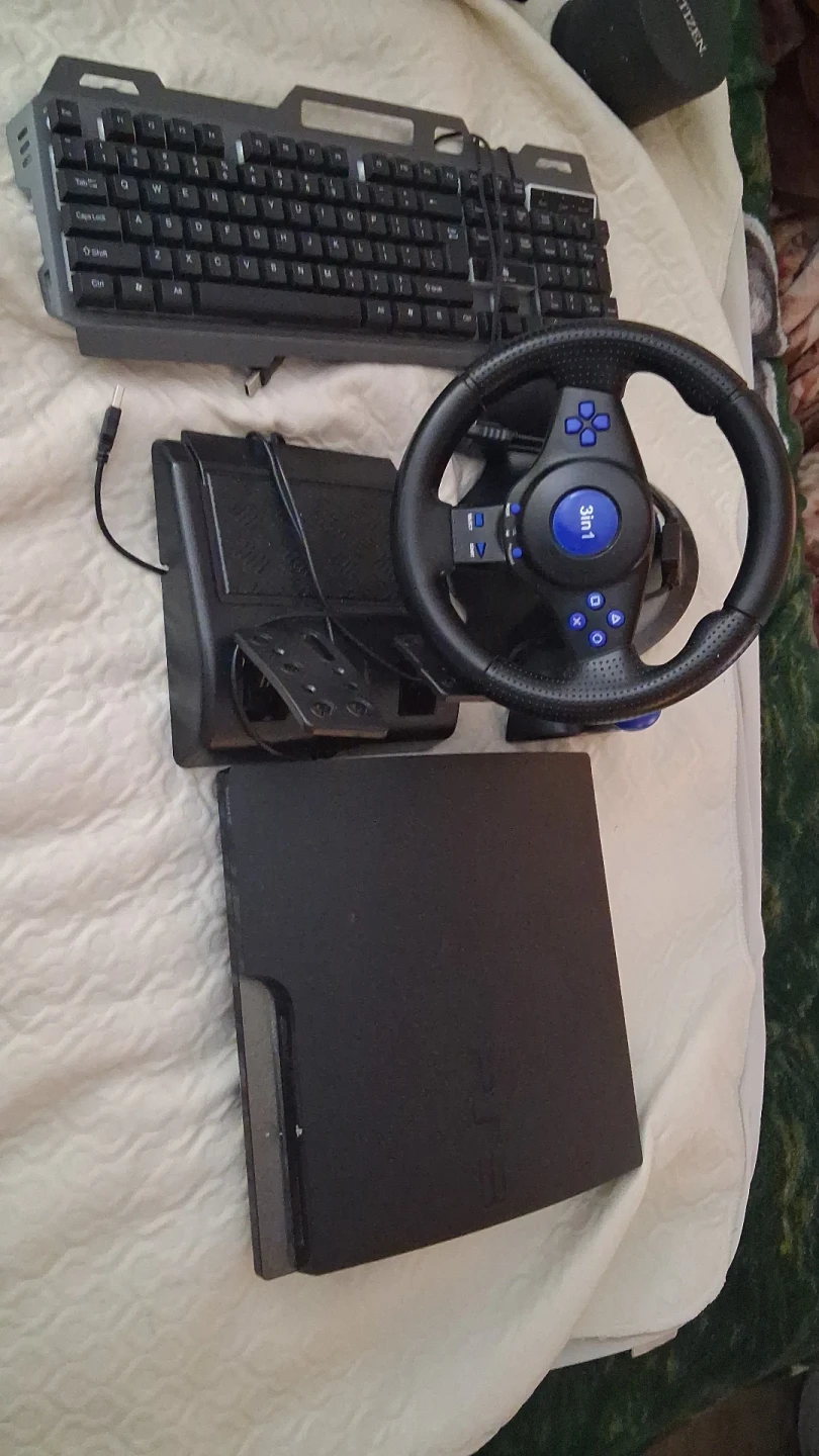 PlayStation 3 Console with Gaming Wheel and Keyboard