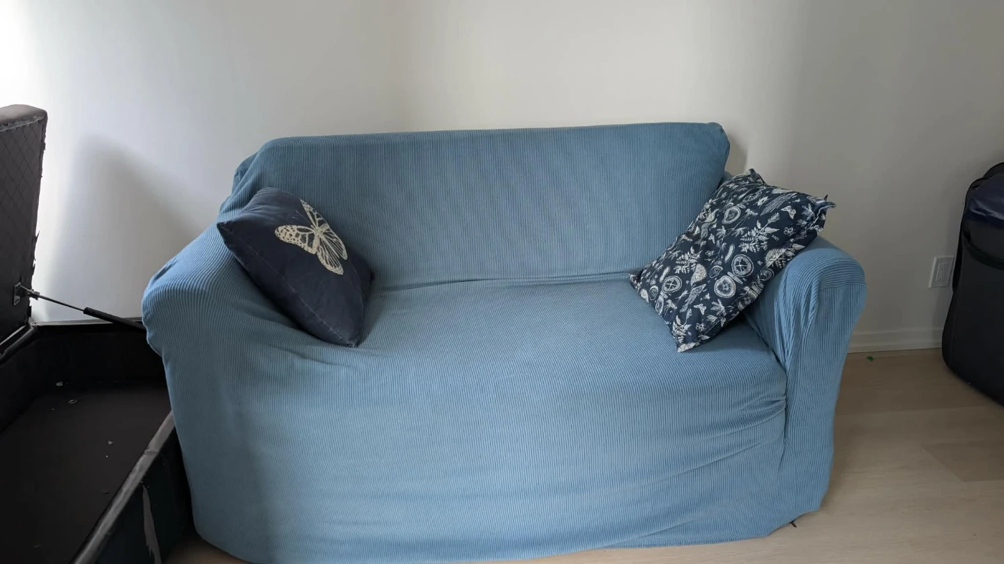 Blue Sofa Bed with blue removable cover and pillows