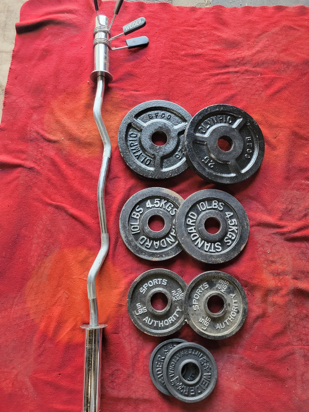 2" HOLE EZ-CURL BAR WITH 85LBSs OLYMPIC PLATES