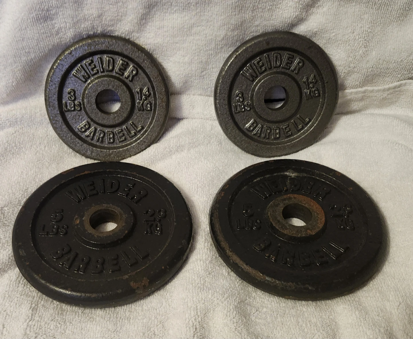 4 Weight Plates 2 Weider 3lbs plates and 2 Weider 5lbs plates - photo 2