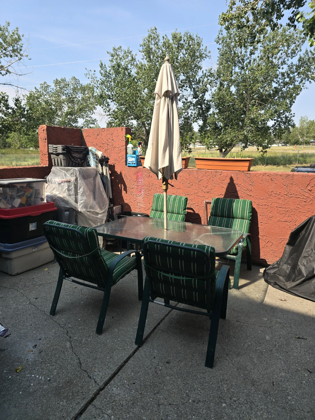 Patio glass table with 4 chairs and cushions